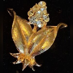 Elegant Goldtone Floral Brooch With Rhinestones